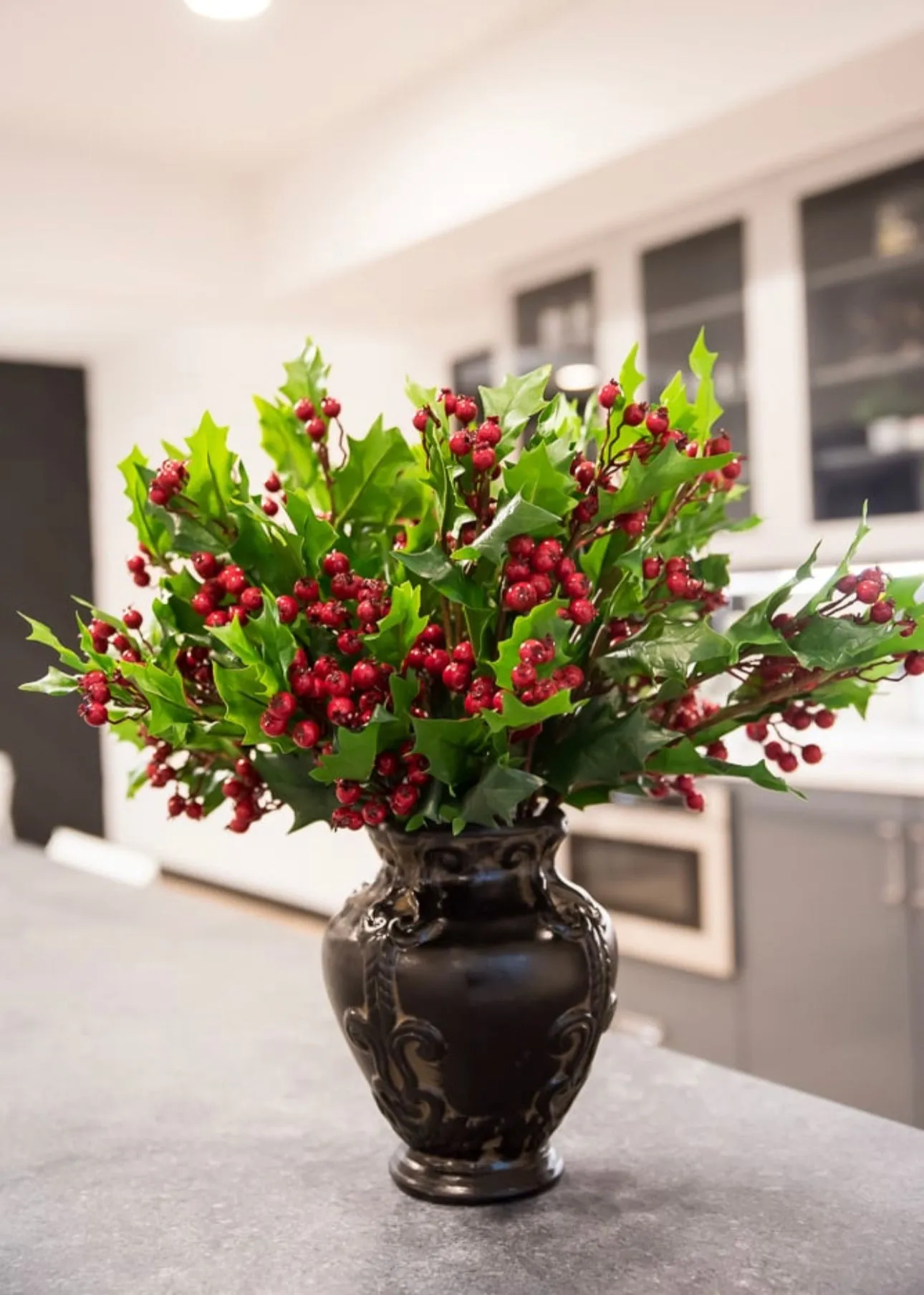 Artificial holly and red berries spray