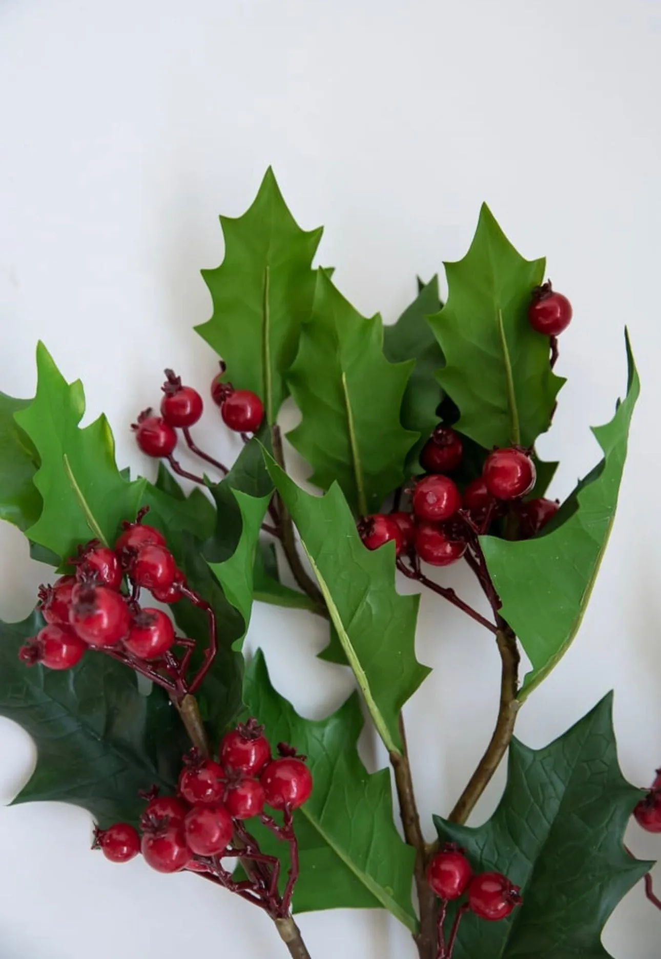 Artificial holly and red berries spray