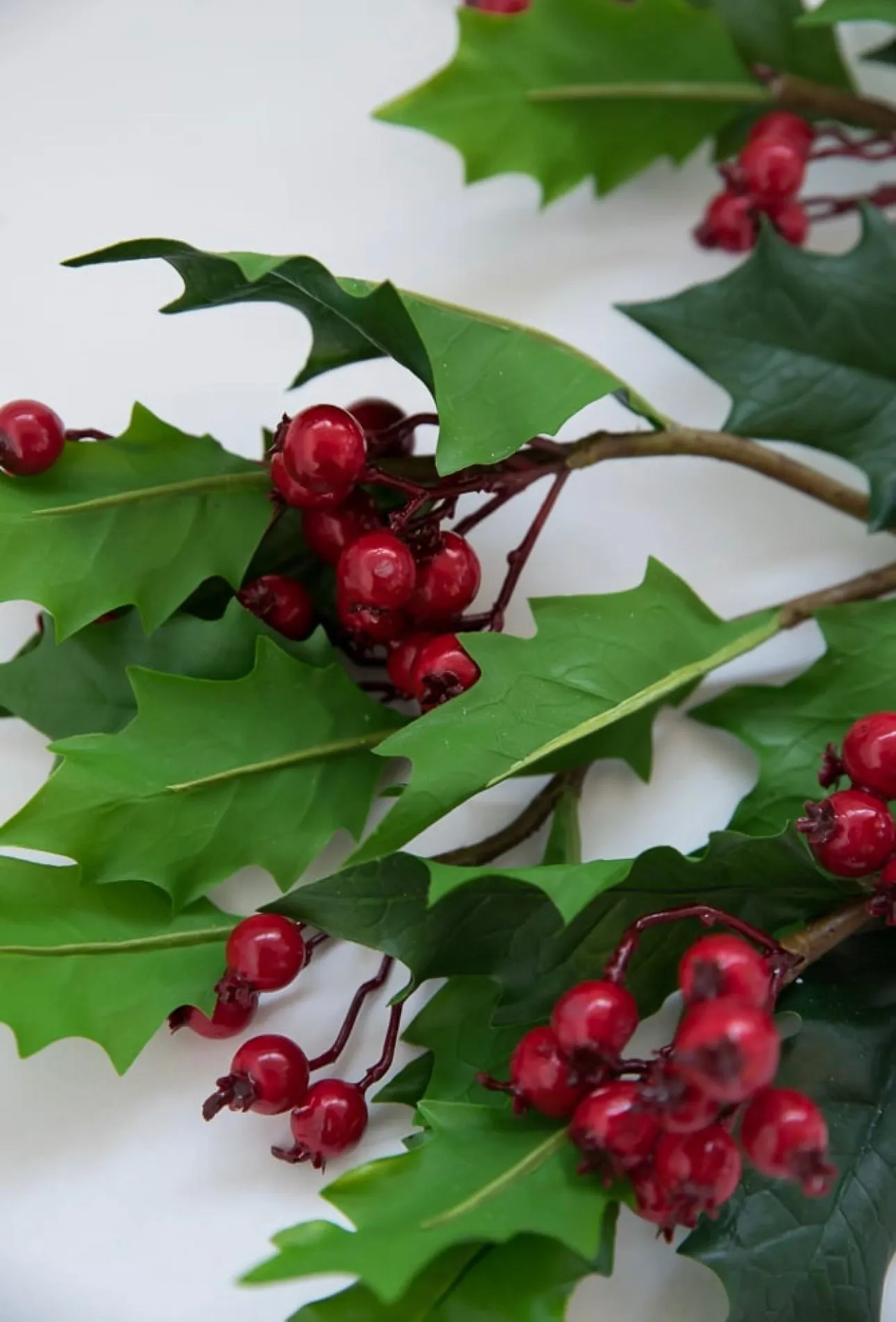 Artificial holly and red berries spray