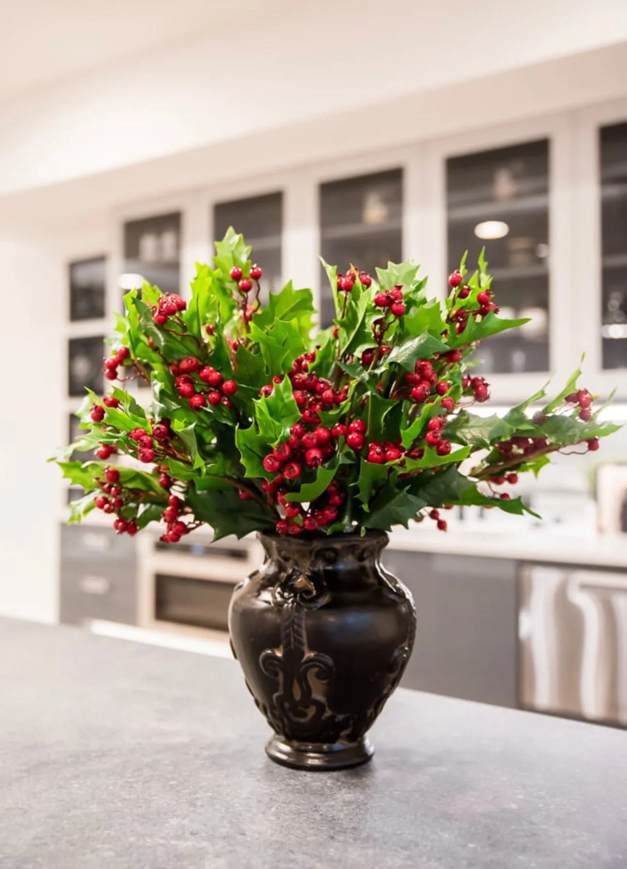 Artificial holly and red berries spray