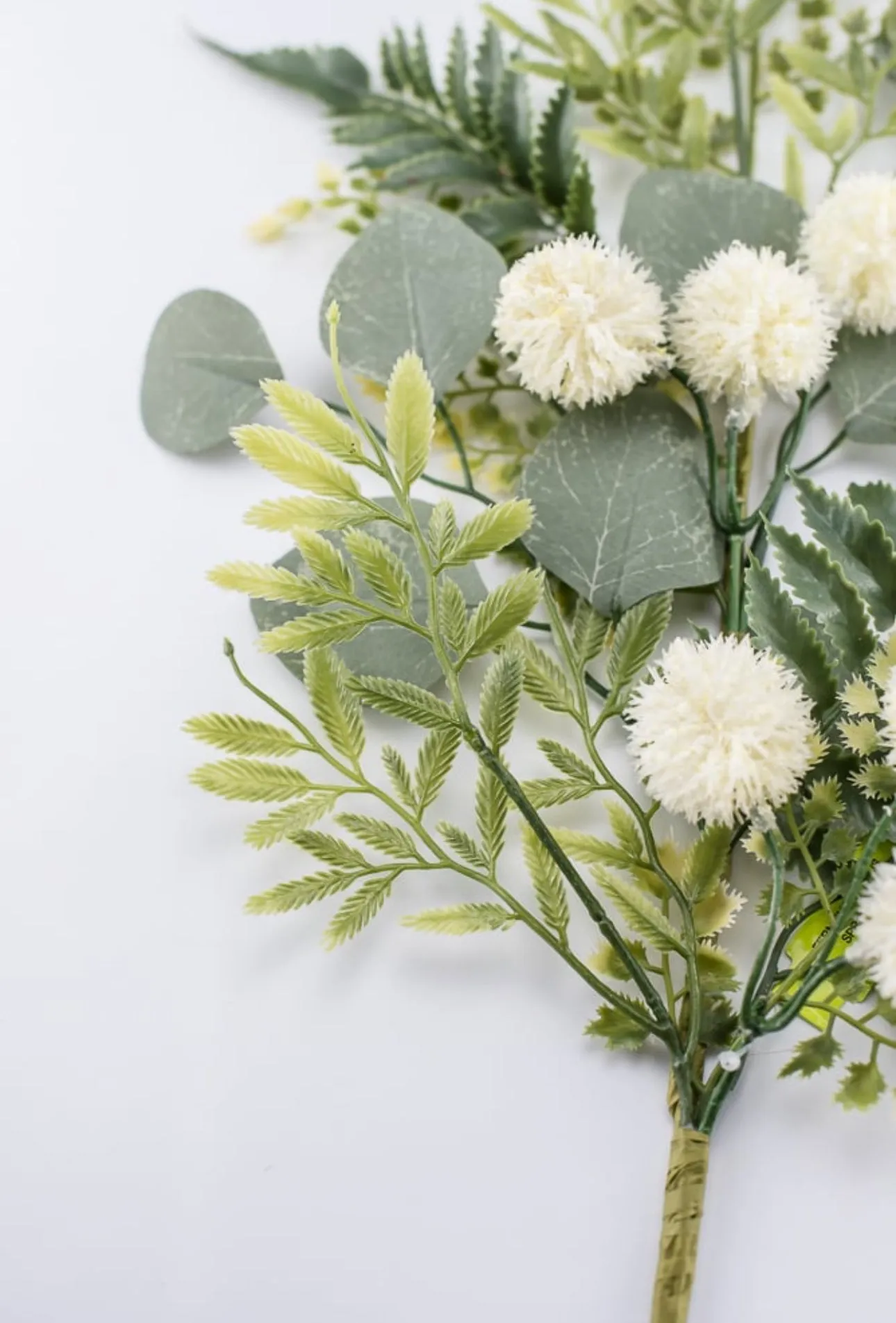 Artificial mixed greenery, thistle, and fern spray - cream green