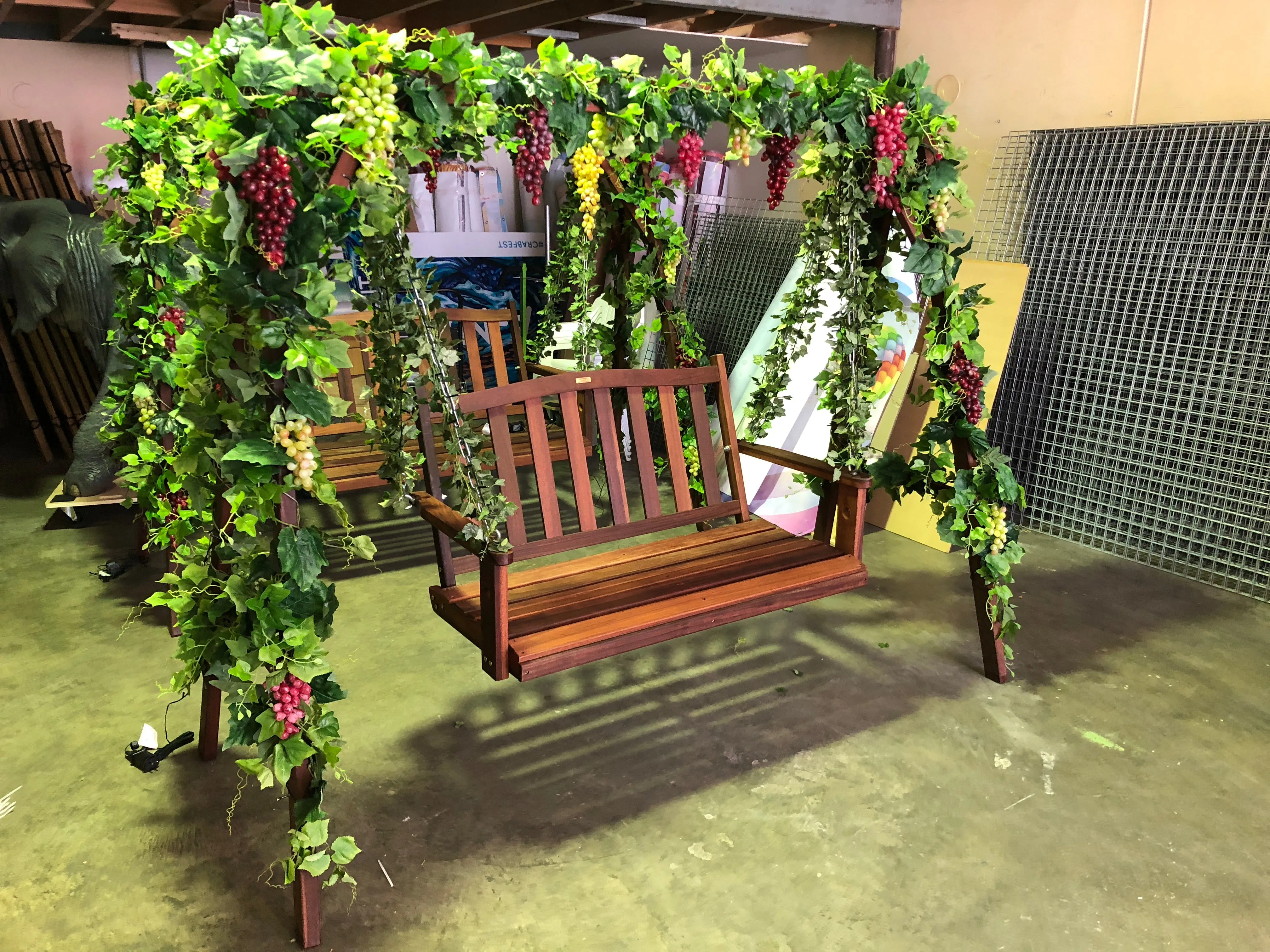 Event Company - Decorating Swing Chairs with Artificial Vines & Grapes